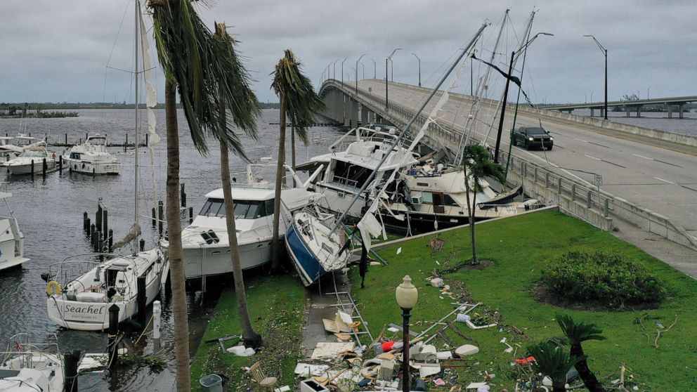 PHOTO: Boats are pushed up on a causeway after Hurricane Ian passed through the area on Sept. 29, 2022 in Fort Myers, Fla.