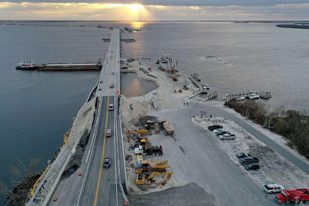 PHOTO: Vehicles drive over the temporarily repaired Sanibel Island causeway less than three weeks after Hurricane Ian destroyed it on October 20, 2022 in Arcadia, Florida.