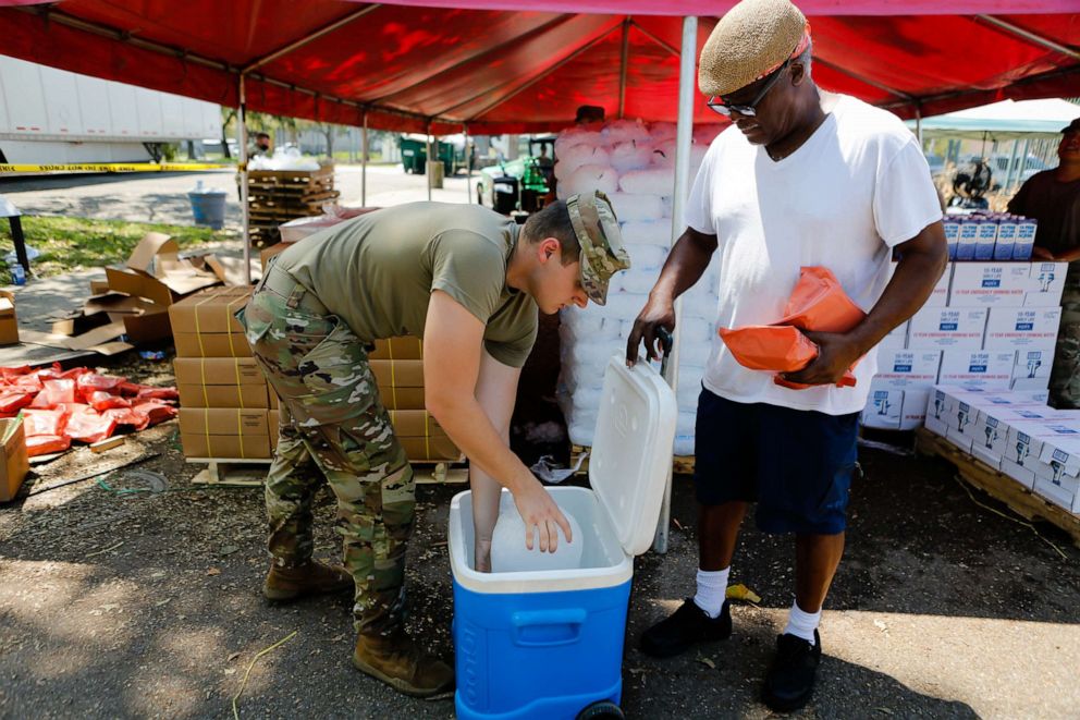 PHOTO: Members of the National Guard hand out supplies at a distribution center after Hurricane Ida in New Orleans, Sept. 3, 2021.