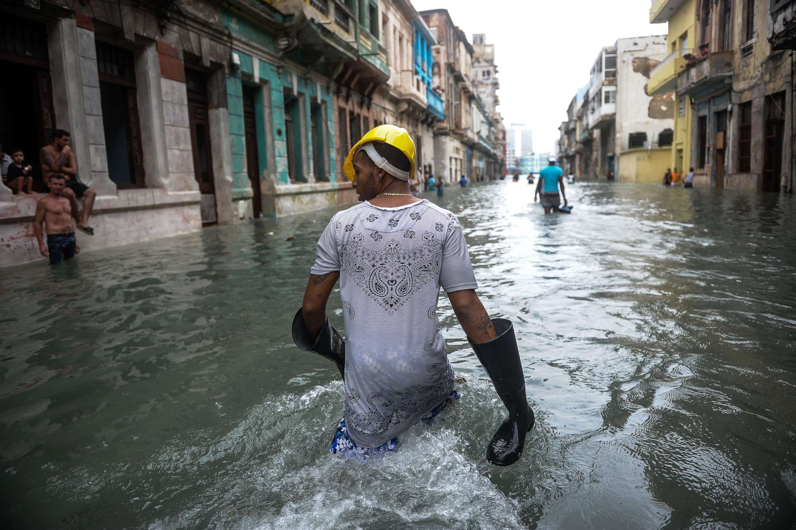 PHOTO: Cubans wade through a flooded street in Havana, Sept. 10, 2017.