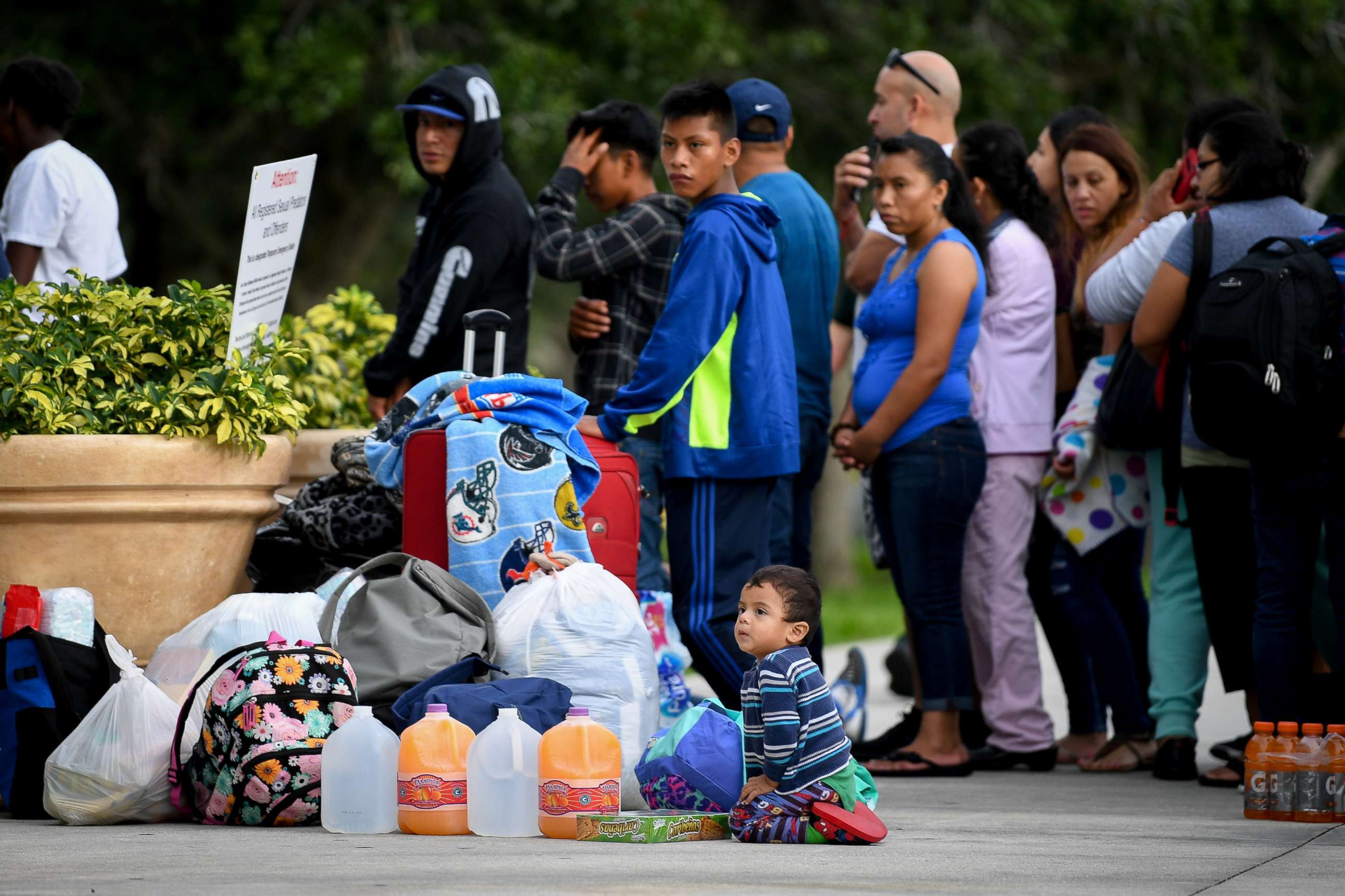 PHOTO: A child plays outside the Germain Arena as families wait to take shelter from Hurricane Irma in Estero, Fla., Sept. 9, 2017. 