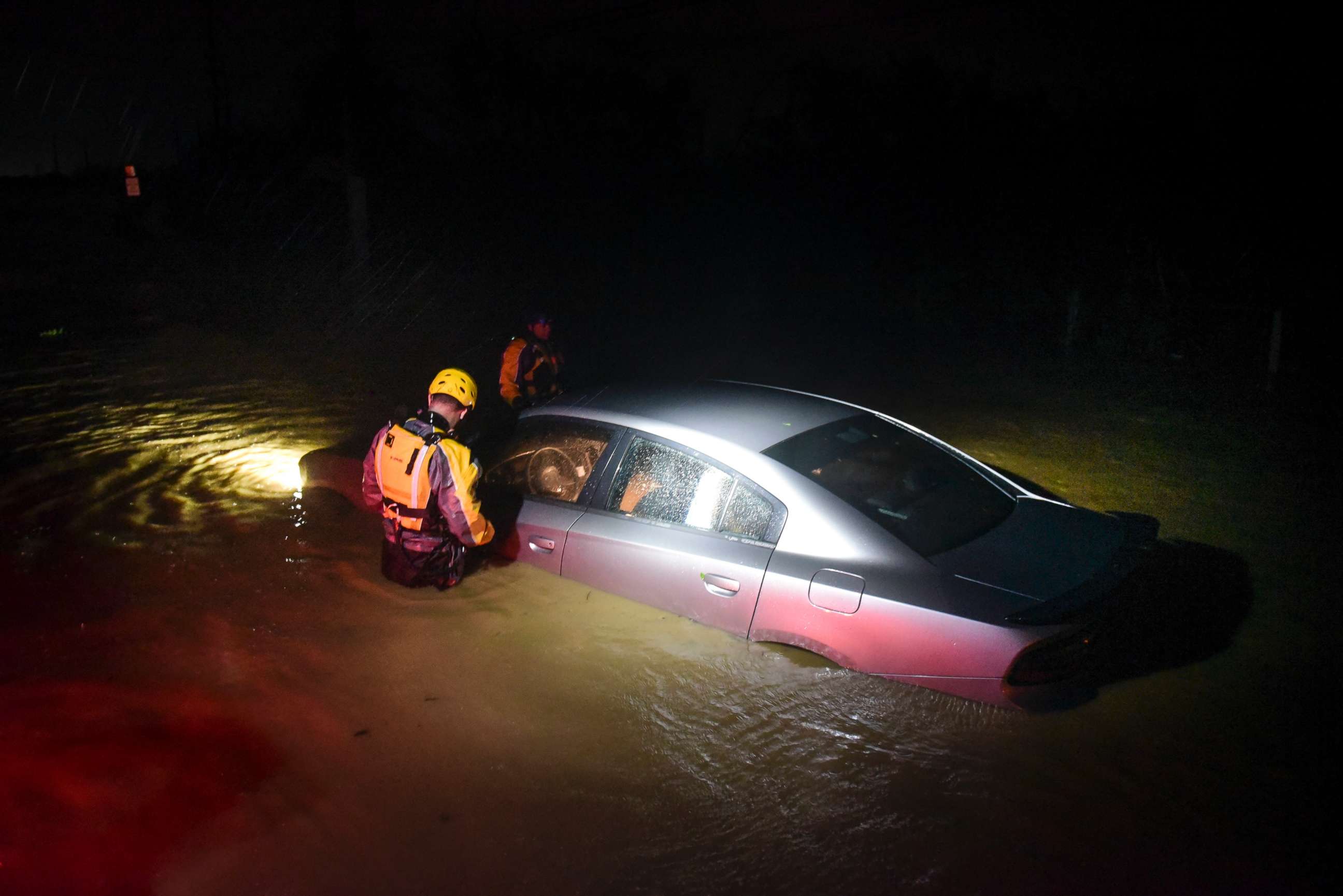 PHOTO: Rescue staff from the Municipal Emergency Management Agency investigate an empty flooded car during the passage of Hurricane Irma through the northeastern part of the island in Fajardo, Puerto Rico, Sept. 6, 2017.