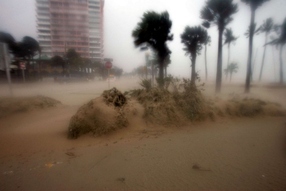 PHOTO: Sand is blown off the beach at Fort Lauderdale, Fla., Aug. 25, 2005 as Hurricane Katrina came ashore.