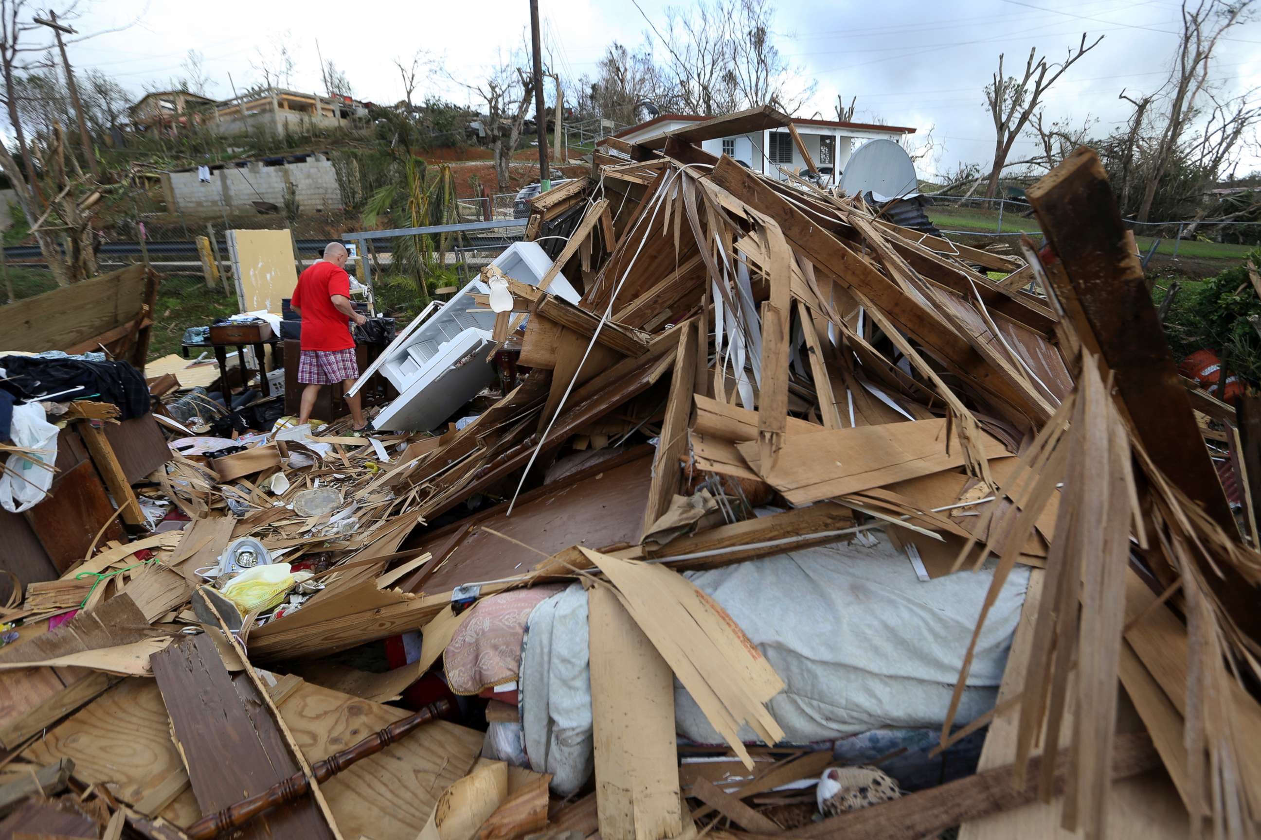 PHOTO: In this Sept. 25, 2017, file photo, Jose Garcia Vicente walks through rubble of his destroyed home, in the aftermath of Hurricane Maria, in Aibonito, Puerto Rico.