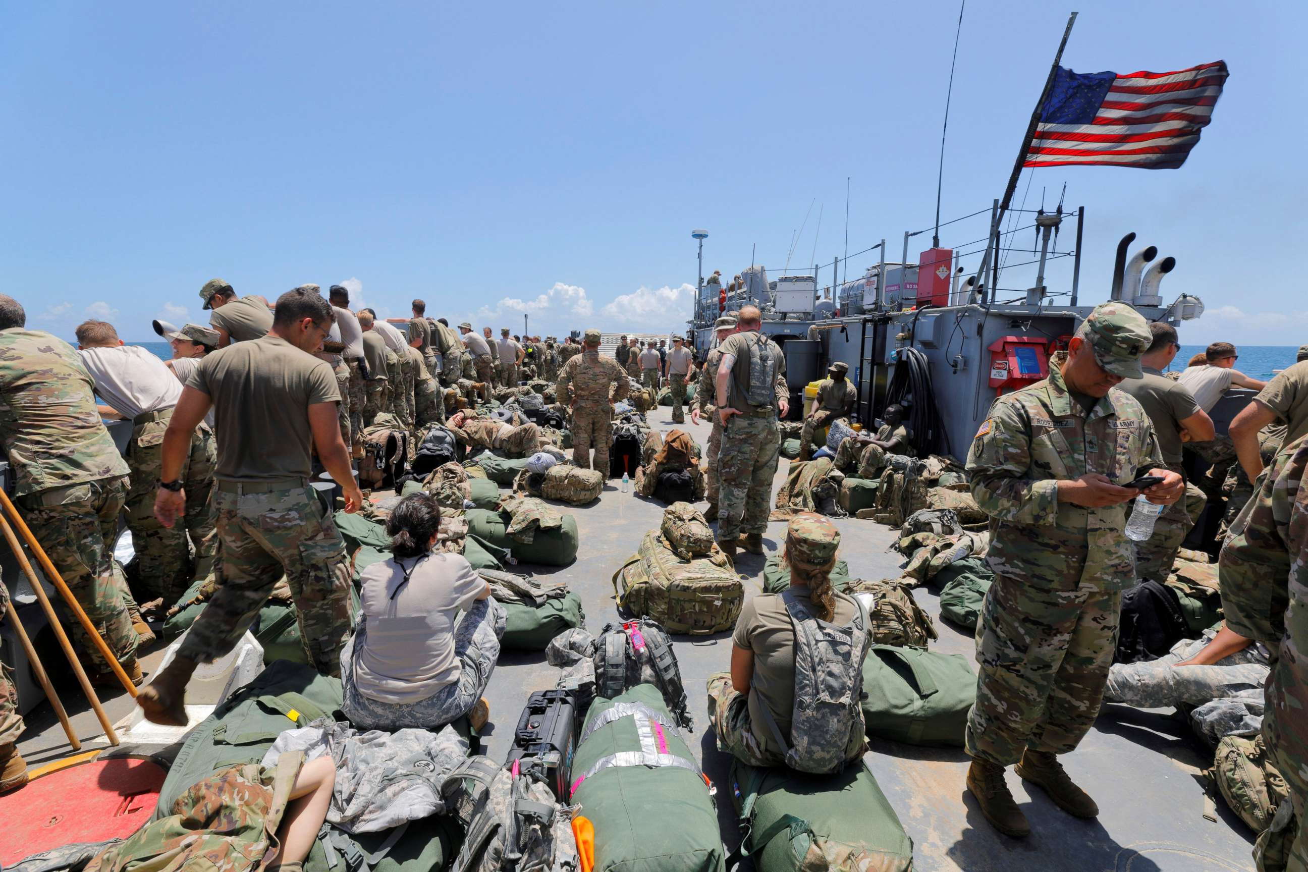 PHOTO: The deck of a U.S. Navy landing craft is crowded with Army soldiers and their belongings as they are evacuated in advance of Hurricane Maria, off St. Thomas shore, U.S. Virgin Islands, Sept. 17, 2017.