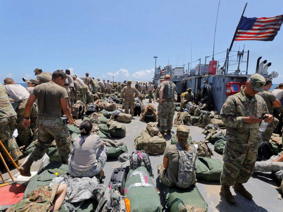 PHOTO: The deck of a U.S. Navy landing craft is crowded with Army soldiers and their belongings as they are evacuated in advance of Hurricane Maria, off St. Thomas shore, U.S. Virgin Islands, Sept. 17, 2017.