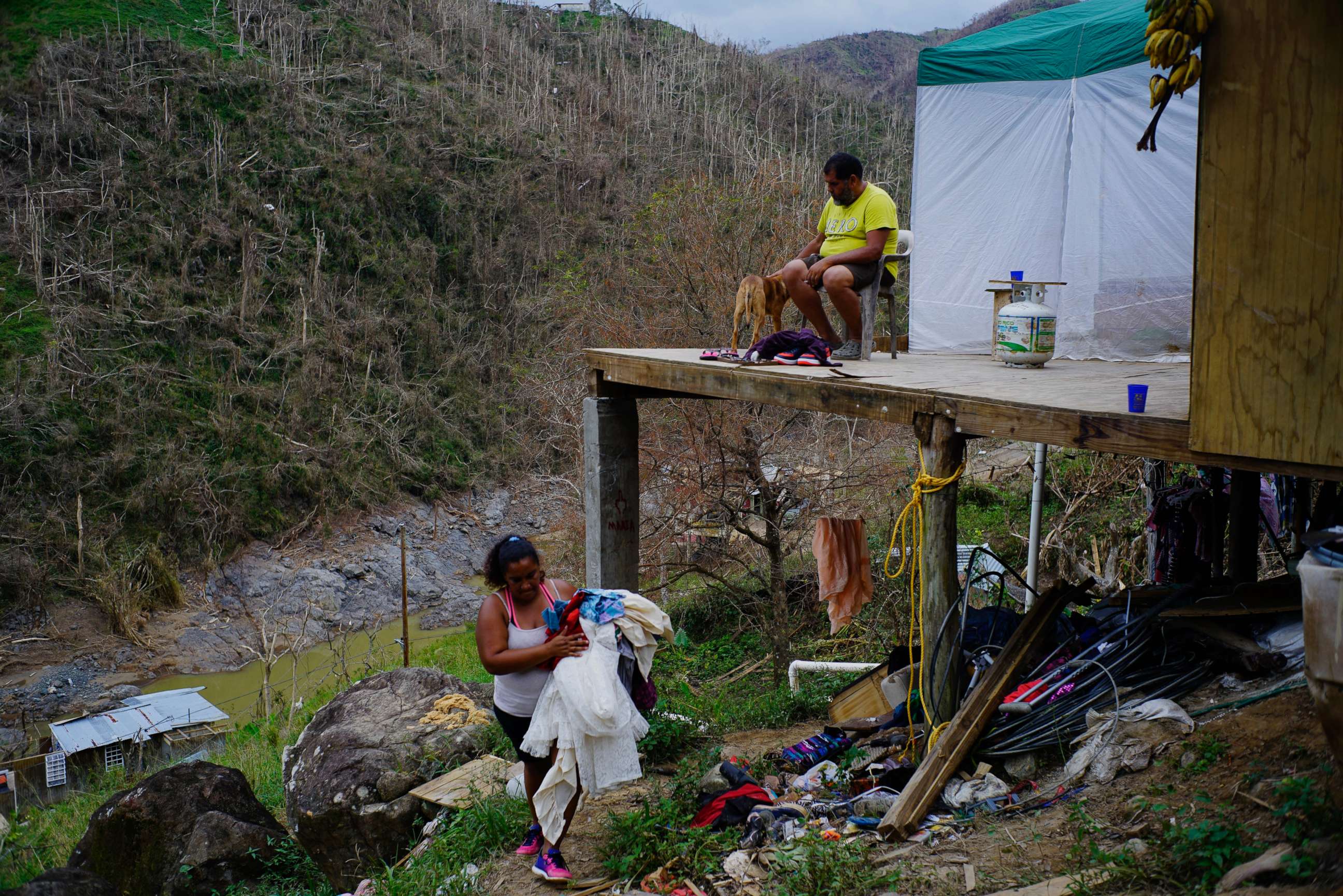 PHOTO: Yadira Sortre and William Fontan Quintero clean their house, destroyed by Hurricane Maria in in Morovis, Puerto Rico, Oct. 1, 2017.