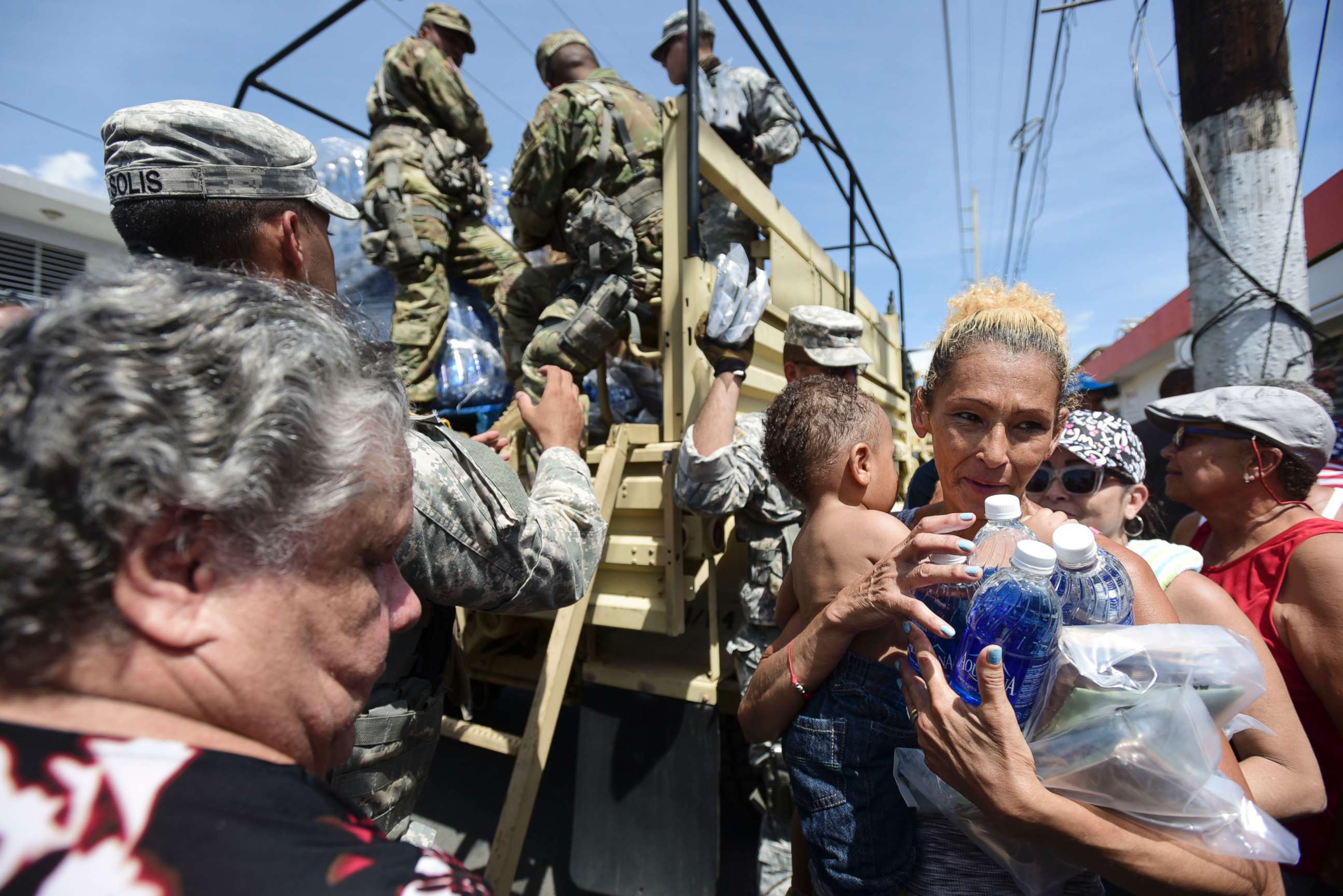 PHOTO: National Guard Soldiers arrive at Barrio Obrero in Santurce to distribute water and food among those affected by the passage of Hurricane Maria, in San Juan, Puerto Rico, Sept. 24, 2017.