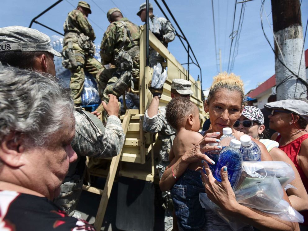 PHOTO: National Guard Soldiers arrive at Barrio Obrero in Santurce to distribute water and food among those affected by the passage of Hurricane Maria, in San Juan, Puerto Rico, Sept. 24, 2017.