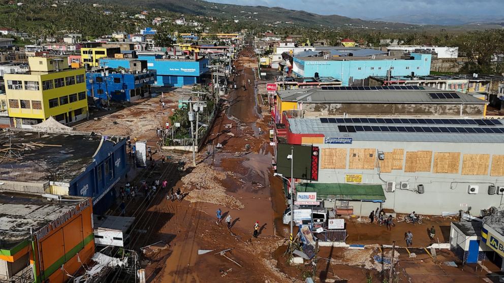 PHOTO: Residents walk through Santa Cruz, Jamaica, Oct. 29, 2025, after Hurricane Melissa passed.