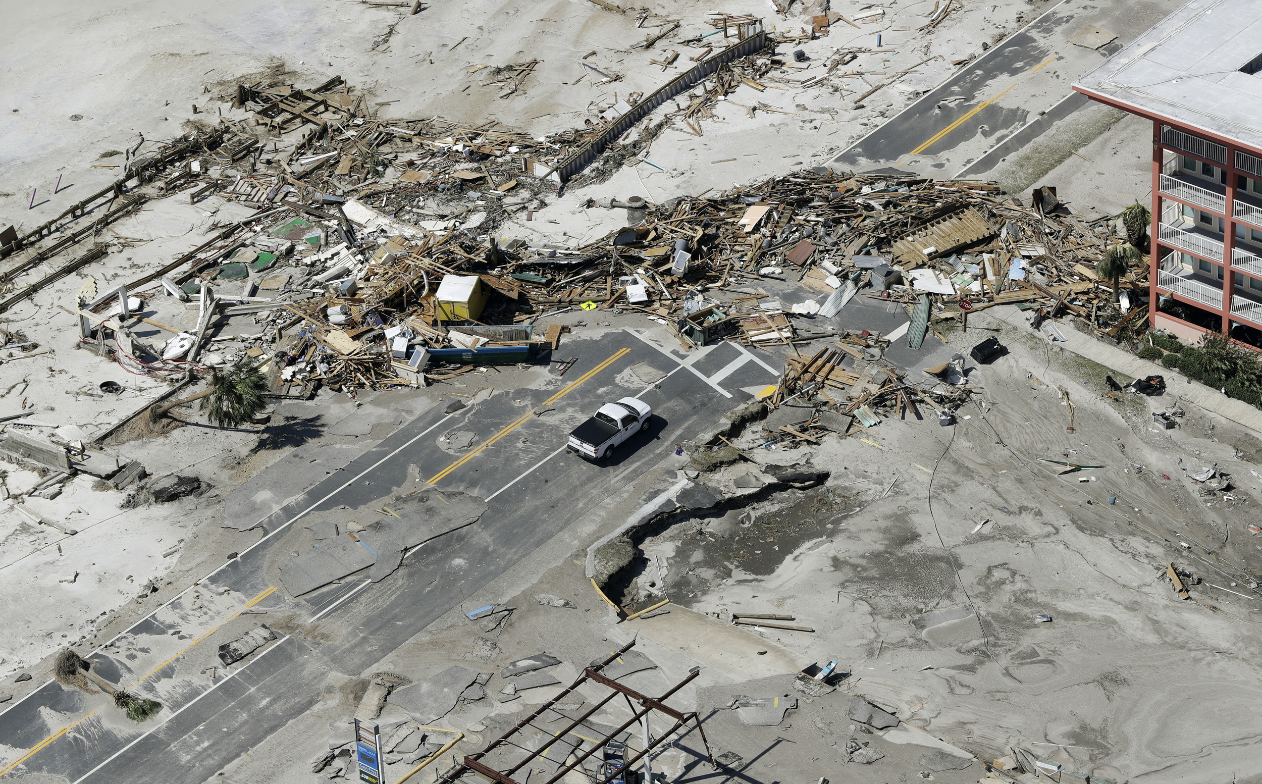 PHOTO: Debris from homes destroyed by Hurricane Michael block a road on Oct. 11, 2018, in Mexico Beach, Fla. 