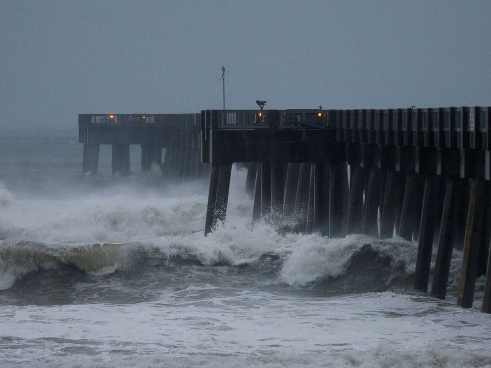 PHOTO: Waves crash along a pier as Hurricane Michael approaches Panama City Beach, Fla. Oct. 10, 2018.