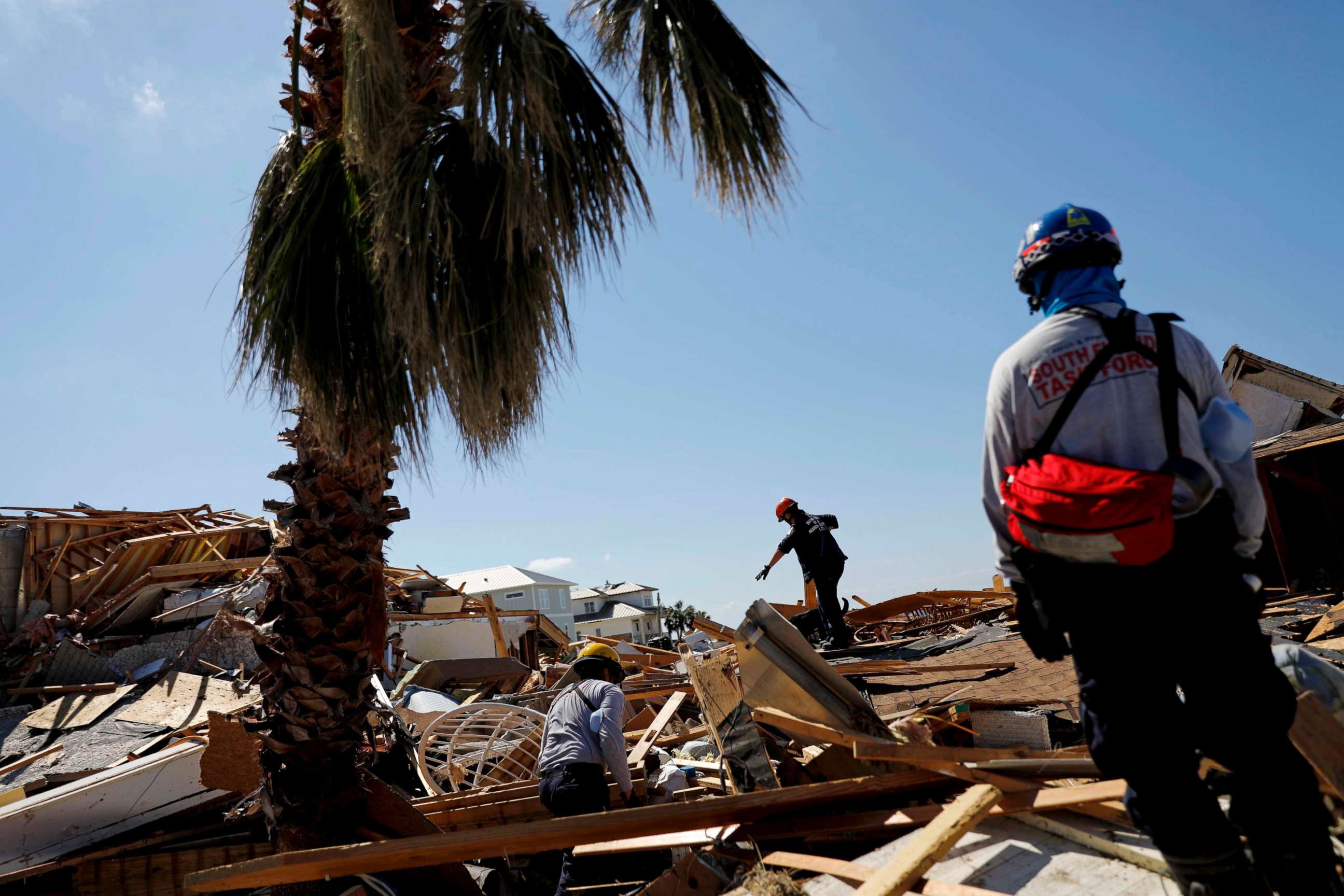 PHOTO: Members of a South Florida urban search and rescue team sift through a debris pile for survivors of Hurricane Michael in Mexico Beach, Fla., Oct. 14, 2018.