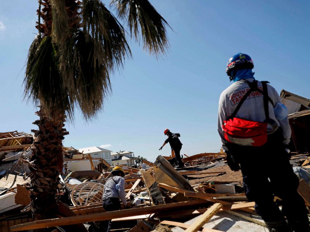 PHOTO: Members of a South Florida urban search and rescue team sift through a debris pile for survivors of Hurricane Michael in Mexico Beach, Fla., Oct. 14, 2018.