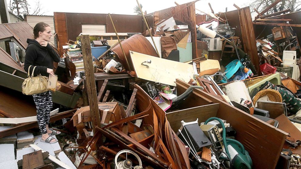 PHOTO: A woman inspects damage to her family property in the Panama City, Fla., after Hurricane Michael made landfall in Florida's Panhandle, Oct. 10, 2018.