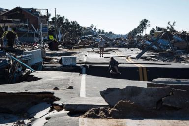 PHOTO: Local residents make their way across a washed out road after category 4 Hurricane Michael made land fall along the Florida panhandle, Oct. 12, 2018 in Mexico Beach, Fla.