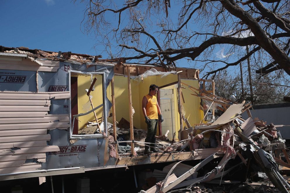 PHOTO: Volunteers help to clear debris left by Hurricane Michael at the severely-damaged Bay Oaks Village trailer park on Oct. 20, 2018 in Panama City, Fla.