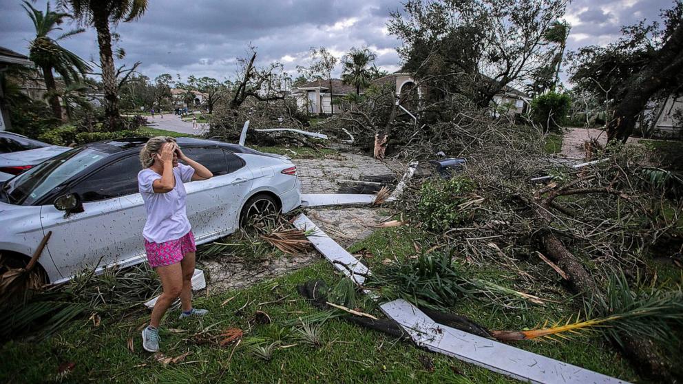 PHOTO: Marie Cook reacts to the damage to her home in the Binks Estates community after a tornado formed by Hurricane Milton touched down striking homes in The Preserve and Binks Estate among others in its path in Wellington, Fla., Oct. 9, 2024.