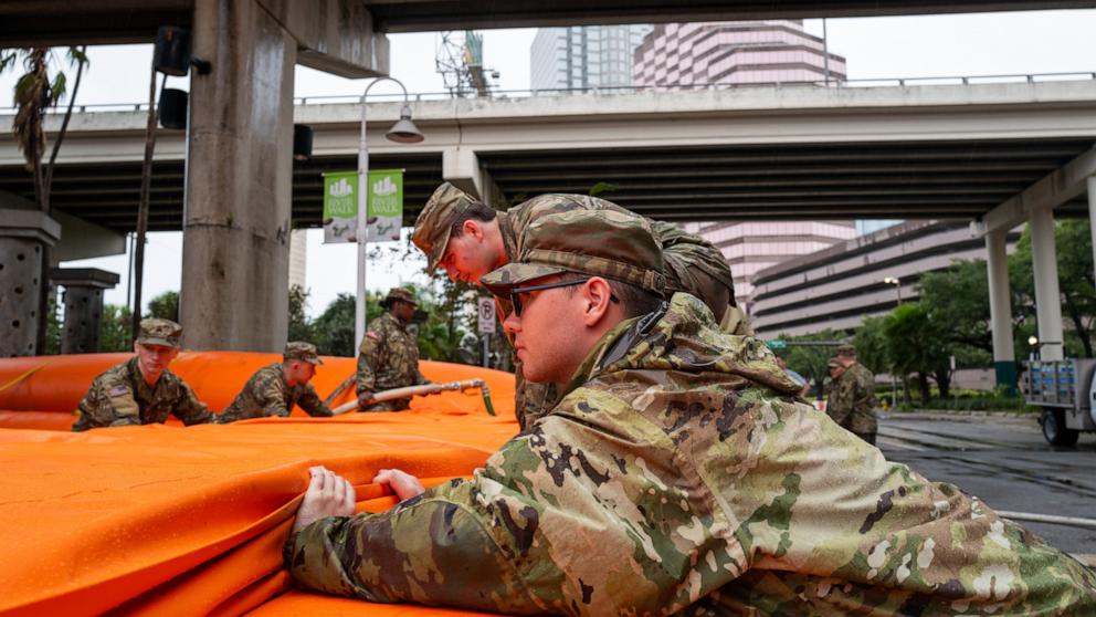 PHOTO: Tampa prepares for the arrival of Hurricane Milton members of the National Guard put up a flood barrier around a waste water facility on Oct. 9, 2024 in Tampa, Fla.