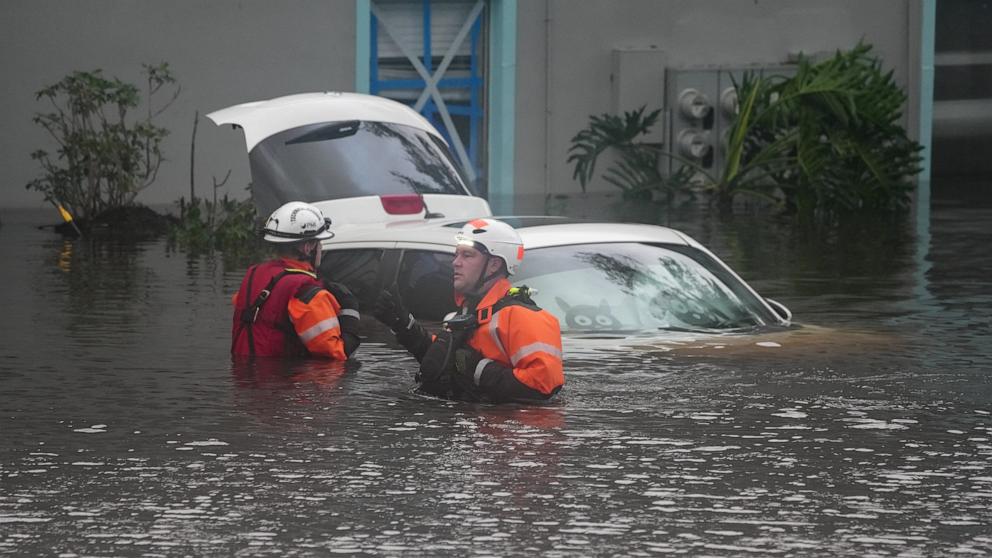 PHOTO: First responders in the water outside an apartment complex that was flooded from and overflowing creek due to Hurricane Milton on Oct. 10, 2024 in Clearwater, Fla.