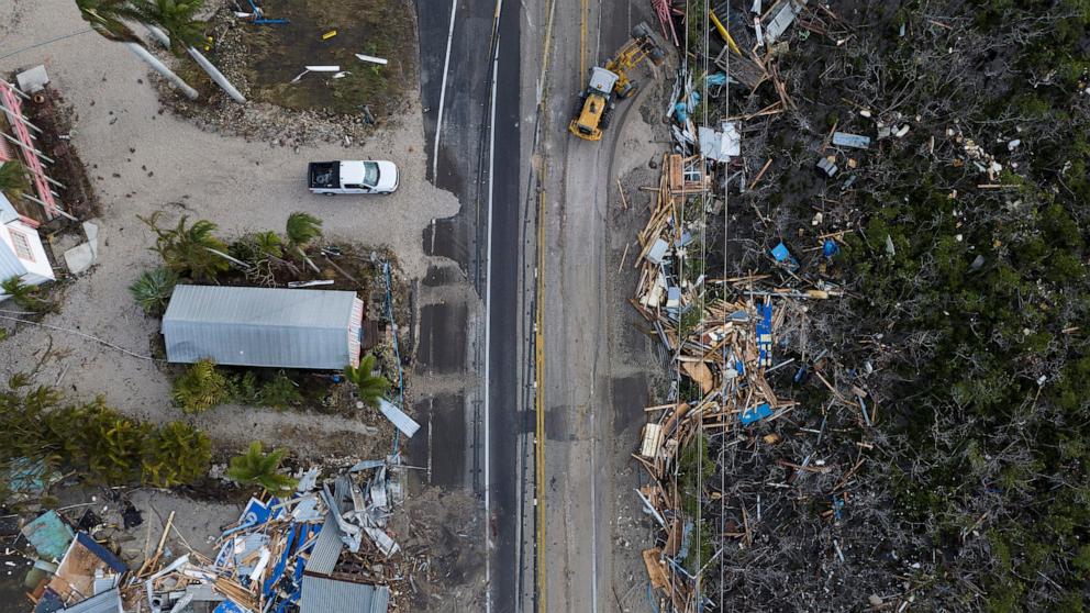PHOTO: A drone view shows a bulldozer removing debris from a road after Hurricane Milton made landfall in Matlacha, Fla., Oct. 10, 2024.