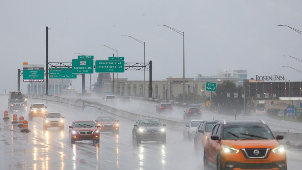 PHOTO: Cars drive during heavy rainfall as Hurricane Milton makes landfall in Orlando, Fla., Oct. 9, 2024.