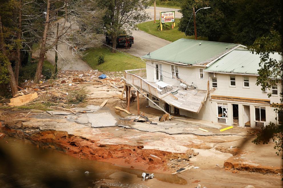 PHOTO: Debris sits near a damaged building near the Broad River after floodwaters sent a violent torrent through the town during Tropical Storm Helene, in Chimney Rock, N.C., Oct. 1, 2024. 