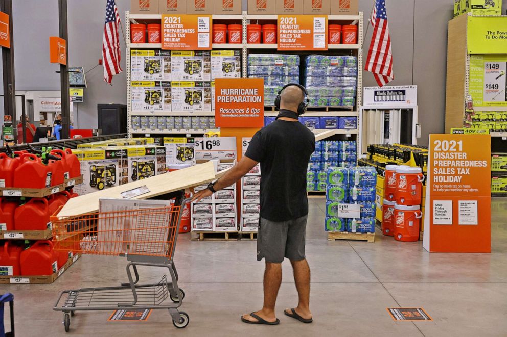 PHOTO: A Home Depot customer looks at hurricane preparation supplies for sale on May 27, 2021 in Doral, Fla. Coolers, batteries, portable generators and other items will be tax-free with a Disaster Preparedness Sales Tax Holiday through June 6.