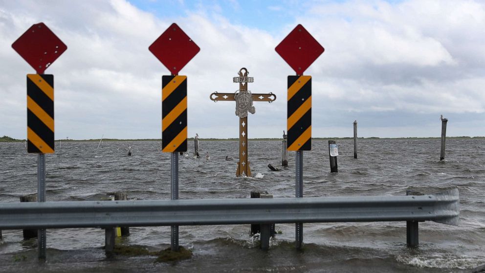 PHOTO: A cross honoring those killed by Hurricane Katrina stands in the Mississippi River-Gulf Outlet before the possible arrival of Hurricane Sally on Sept. 14, 2020, in Shell Beach, La.