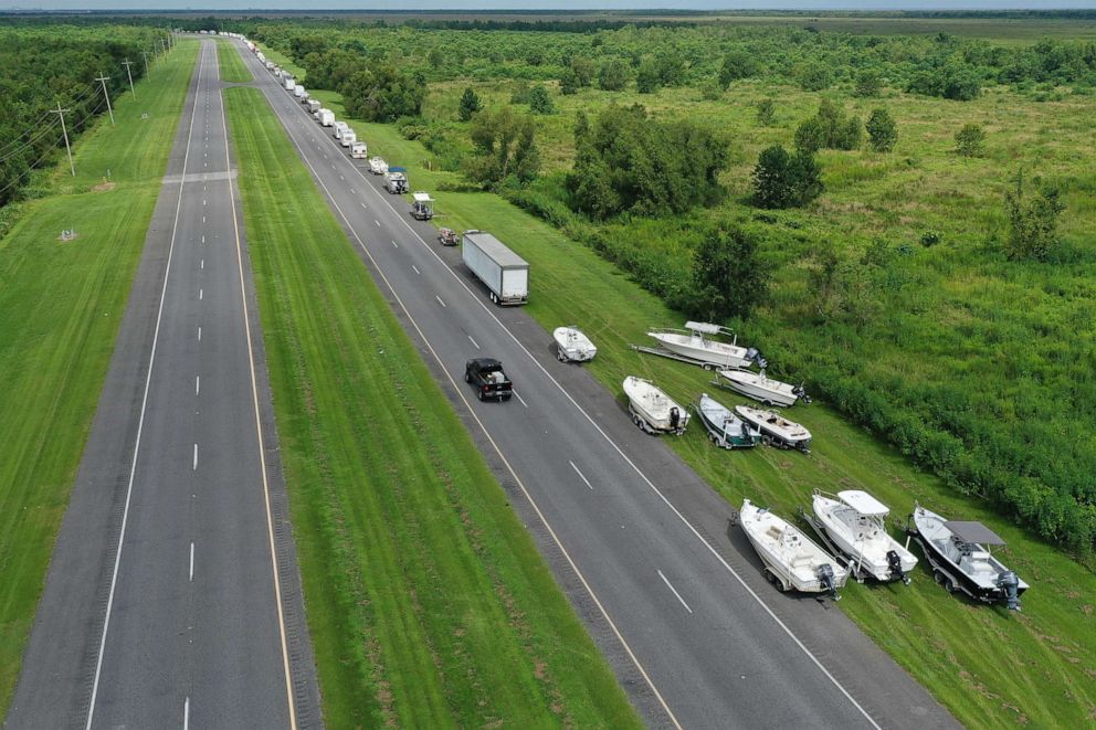 PHOTO: An aerial view from a drone shows boats and vehicles along the side of route 46 as people try to put them on higher ground before the possible arrival of Hurricane Sally on Sept. 14, 2020, in Shell Beach, La.