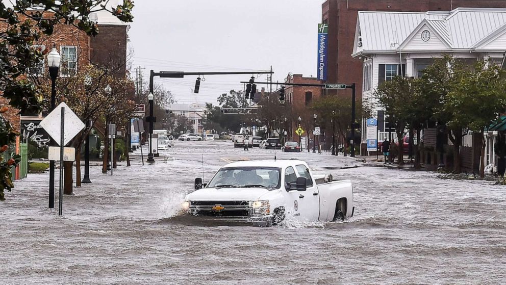 PHOTO: In this Sept. 16, 2020, file photo, a city worker drives through the flooded street during Hurricane Sally in downtown Pensacola, Fla.
