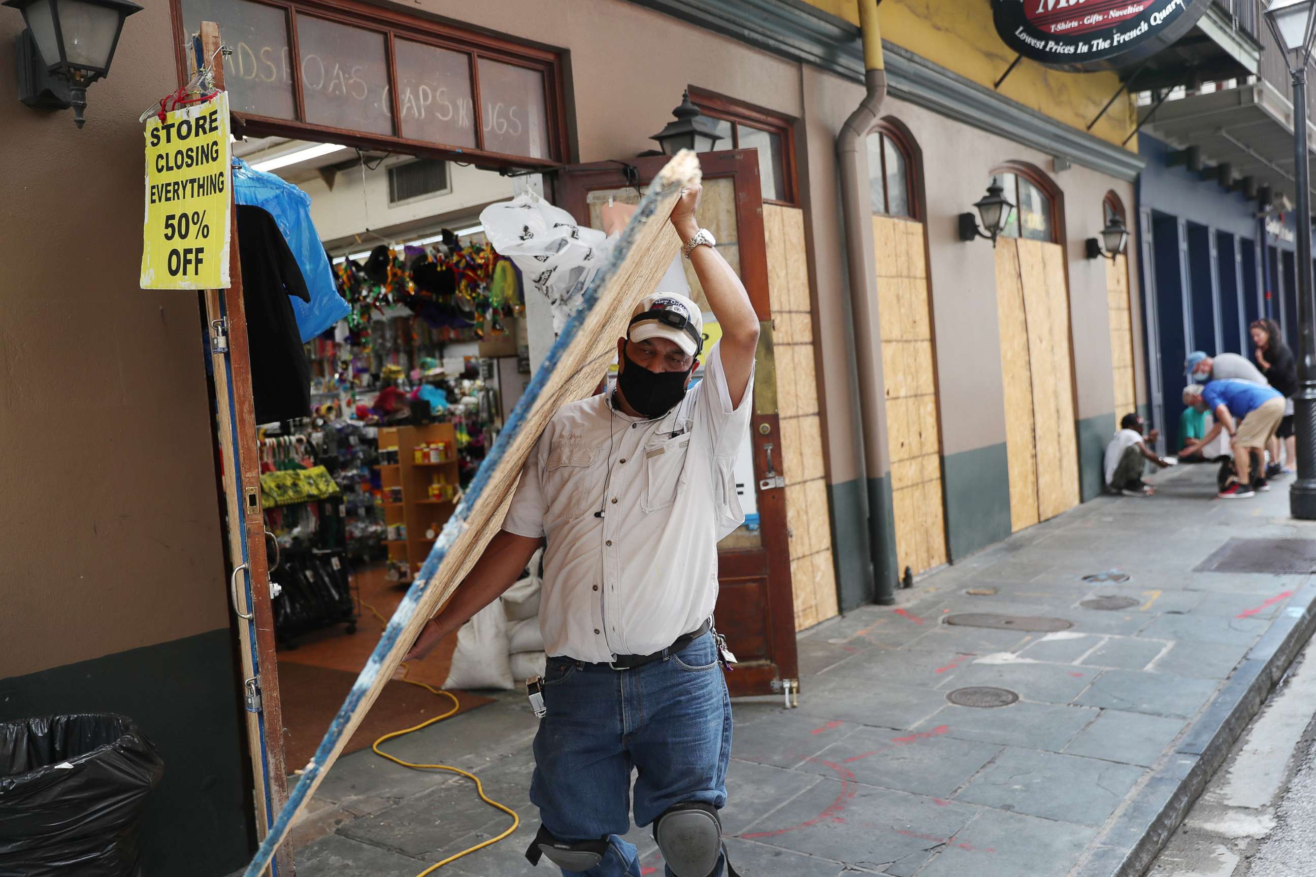 PHOTO: Luis A. Sanabria puts plywood over the windows of a business in the historic French Quarter before the possible arrival of Hurricane Sally on Sept. 14, 2020, in New Orleans.