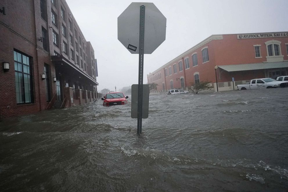 PHOTO: Floodwaters move on the street, Sept. 16, 2020, in Pensacola, Fla.