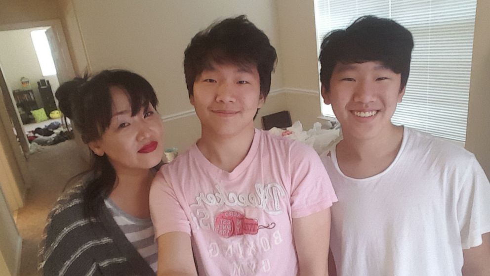 PHOTO: Atlanta spa shooting victim Hyun Jung Grant is seen (L) with her sons.
