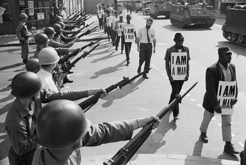 PHOTO: National Guard troops block off Beale Street as Civil Rights marchers wearing placards reading, "I AM A MAN" pass by on March 29, 1968, in Memphis, Tenn.