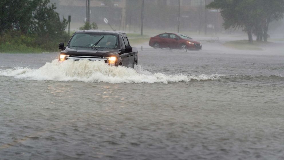 PHOTO: A motorist drives though high water, as another turns around during the effects from Hurricane Ian, Sept. 30, 2022, in Charleston, S.C.