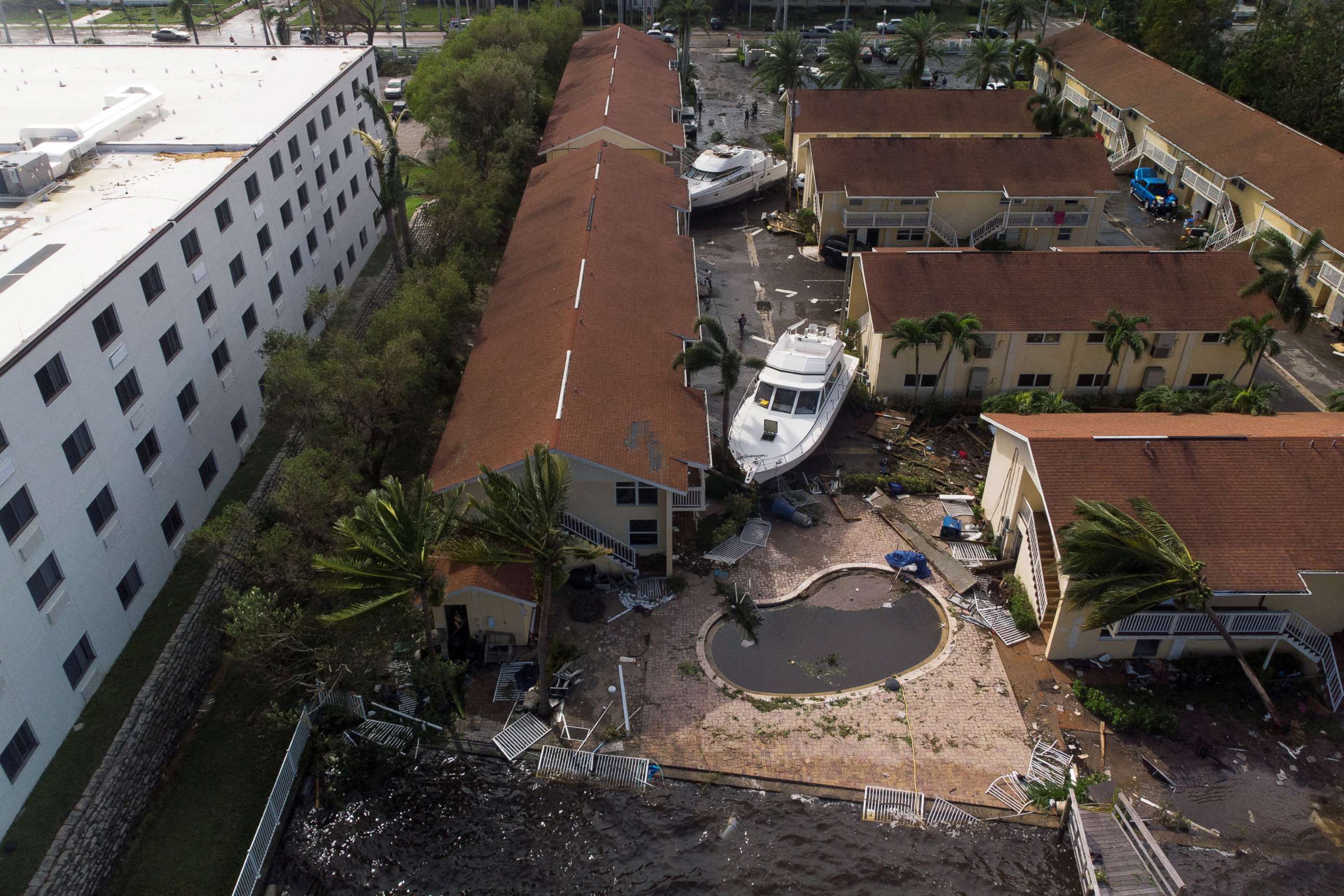 PHOTO: Damaged boats are seen amid a downtown condominium after Hurricane Ian caused widespread destruction, in Fort Myers, Florida, Sept. 29, 2022.