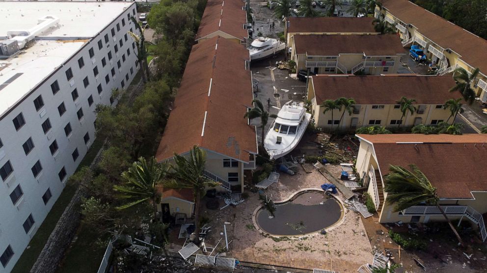 PHOTO: Damaged boats are seen amid a downtown condominium after Hurricane Ian caused widespread destruction, in Fort Myers, Florida, Sept. 29, 2022.