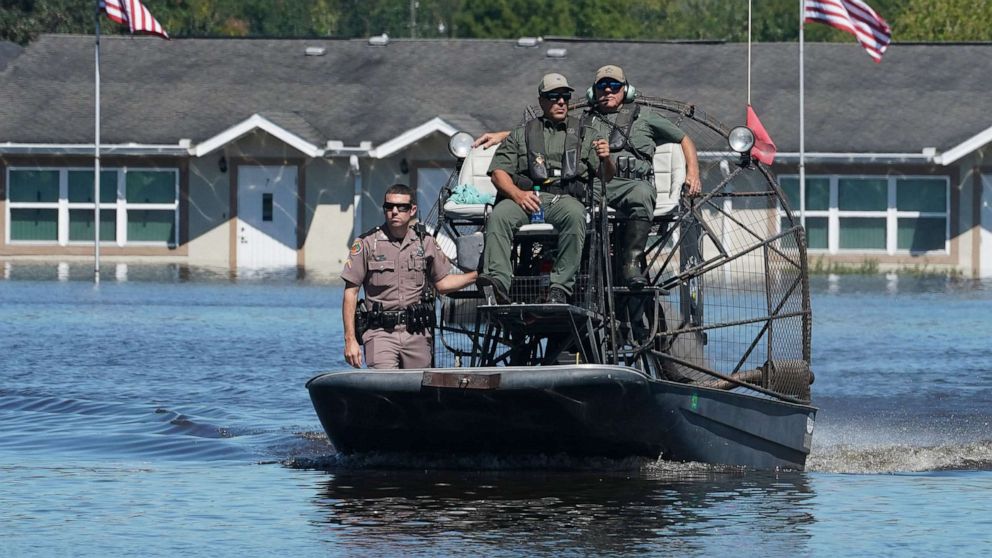 PHOTO: Osceola County Sheriffs use a fanboat as they urge residents to leave the flooded Good Samaritan Society following Hurricane Ian, Sept. 30, 2022, in Kissimmee, Fla. 