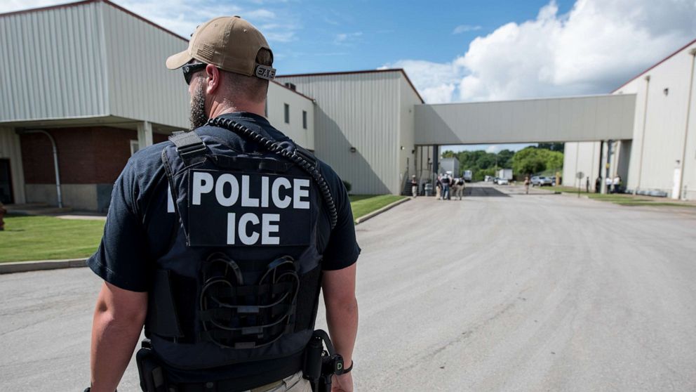 PHOTO: In this June 19, 2018, file photo, a US Immigration and Customs Enforcement (ICE) special agent prepares to arrest alleged immigration violators at Fresh Mark in Salem, Ohio.