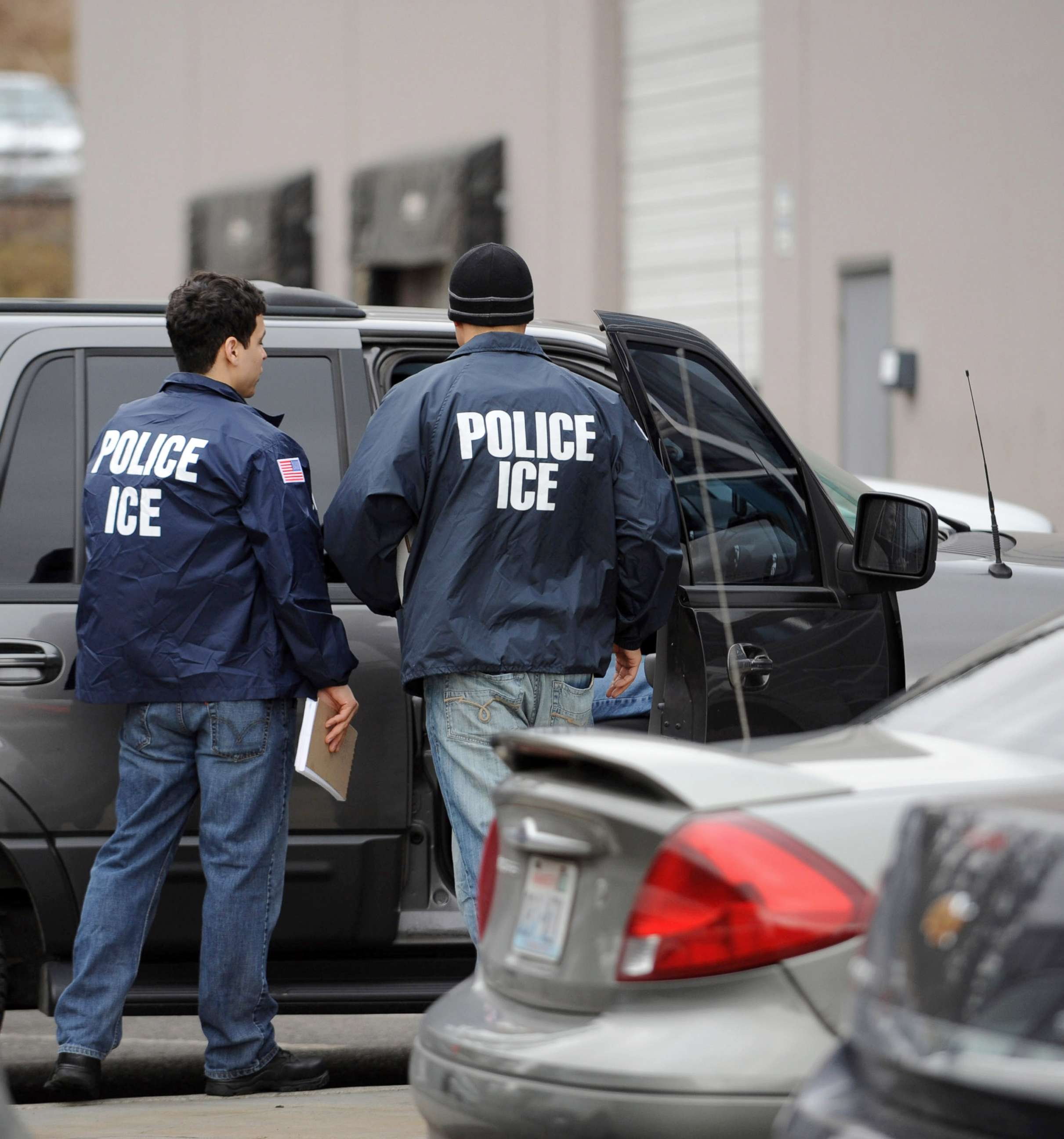 PHOTO: U.S. Immigration and Customs Enforcement agents leave the Yamato Engine Specialist plant in Bellingham, Washington, after raiding the plant for illegal immigrants, Feb. 24, 2009.