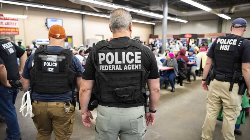 PHOTO: Officers from Immigration and Customs Enforcement (ICE) look on after executing search warrants and making some arrests at an agricultural processing facility in Canton, Miss., in this Aug. 7, 2019 handout photo.   