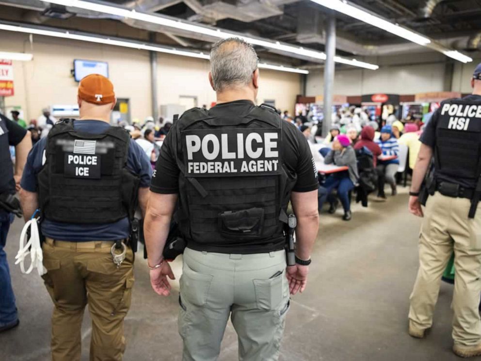 PHOTO: Officers from Immigration and Customs Enforcement look on after executing search warrants and making some arrests at an agricultural processing facility in Canton, Miss., in this photo released by ICE on Aug. 7, 2019.