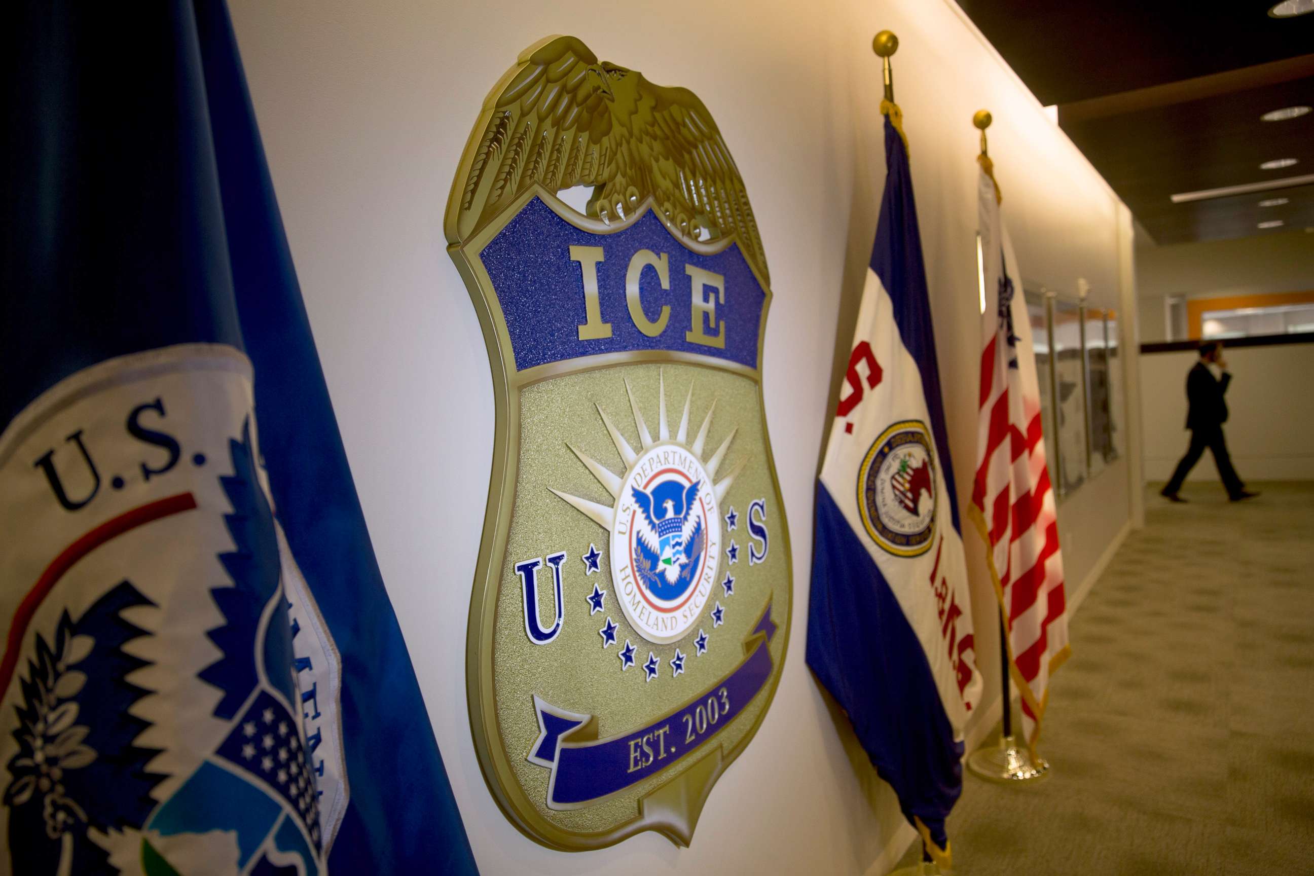 PHOTO: The U.S. Immigration and Customs Enforcement (ICE) seal hangs on a wall at the headquarters in Washington, D.C.