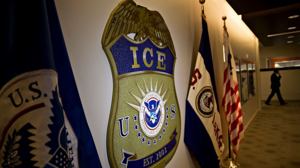PHOTO: The U.S. Immigration and Customs Enforcement (ICE) seal hangs on a wall at the headquarters in Washington, D.C. on Nov. 20, 2014. 