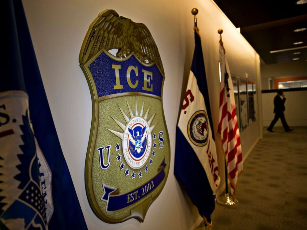 PHOTO: The U.S. Immigration and Customs Enforcement (ICE) seal hangs on a wall at the headquarters in Washington, D.C. on Nov. 20, 2014.