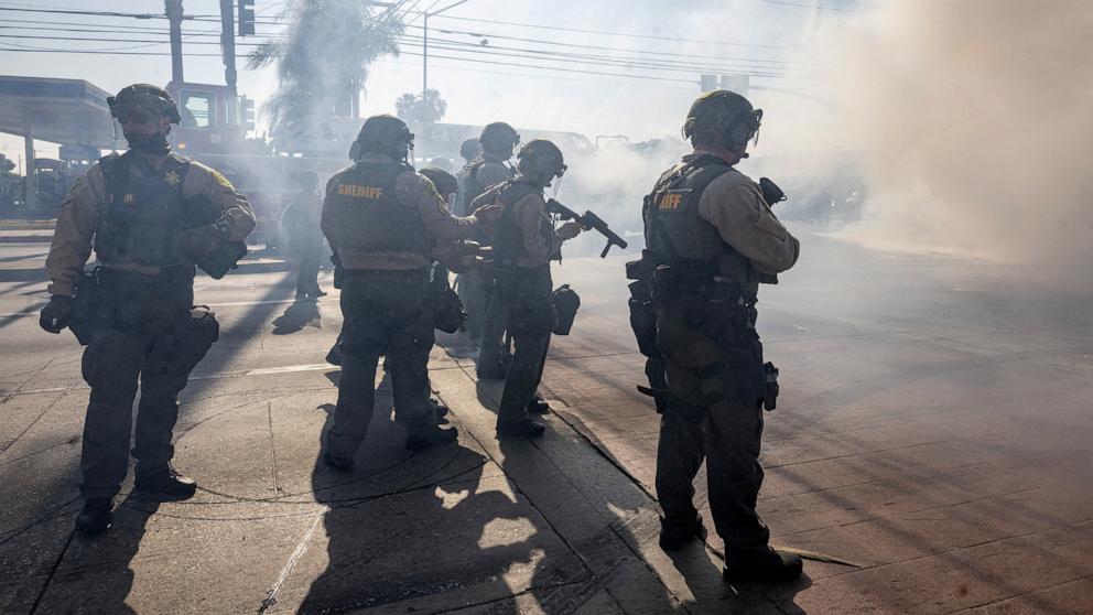 PHOTO: Los Angeles County Sheriff deputies stand guard, during a standoff by protesters and law enforcement following multiple detentions by ICE, in the Los Angeles County city of Paramount, Calif., June 7, 2025.