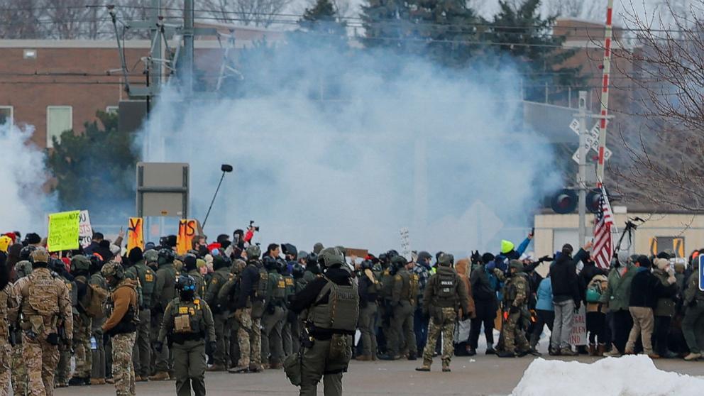 PHOTO: Demonstrators stand amid tear gas as they take part in a protest against the fatal shooting of Renee Nicole Good by a U.S. Immigration and Customs Enforcement agent, during a rally outside the Whipple Building in Minneapolis, January 8, 2026.