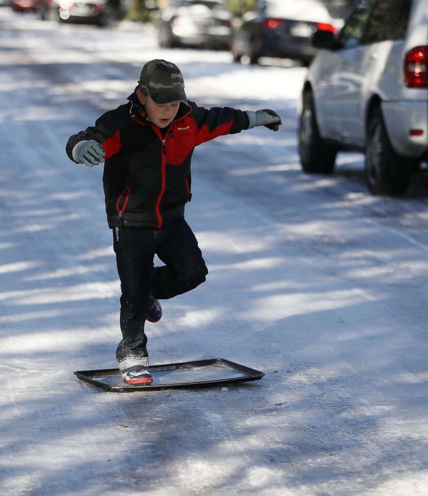 PHOTO: Shebuel Fenster slides along an ice covered street in Savannah, Georgia, Jan. 4, 2018.