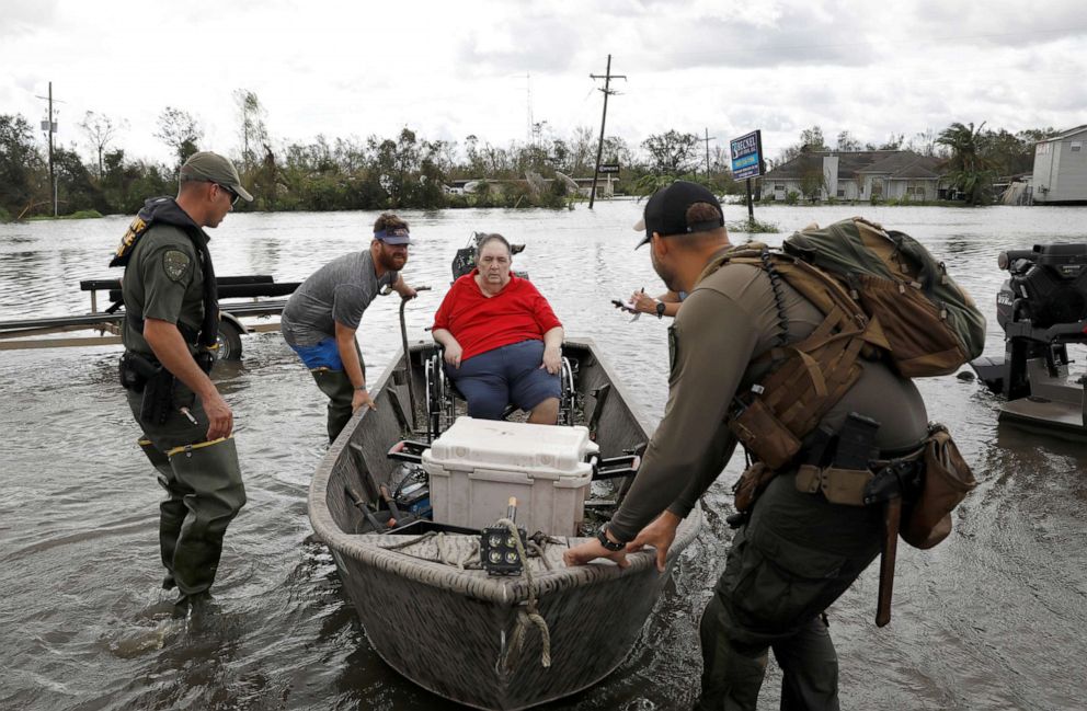 PHOTO: Members of a rescue team help evacuate people after Hurricane Ida made landfall in Laplace, La., Aug. 30, 2021.